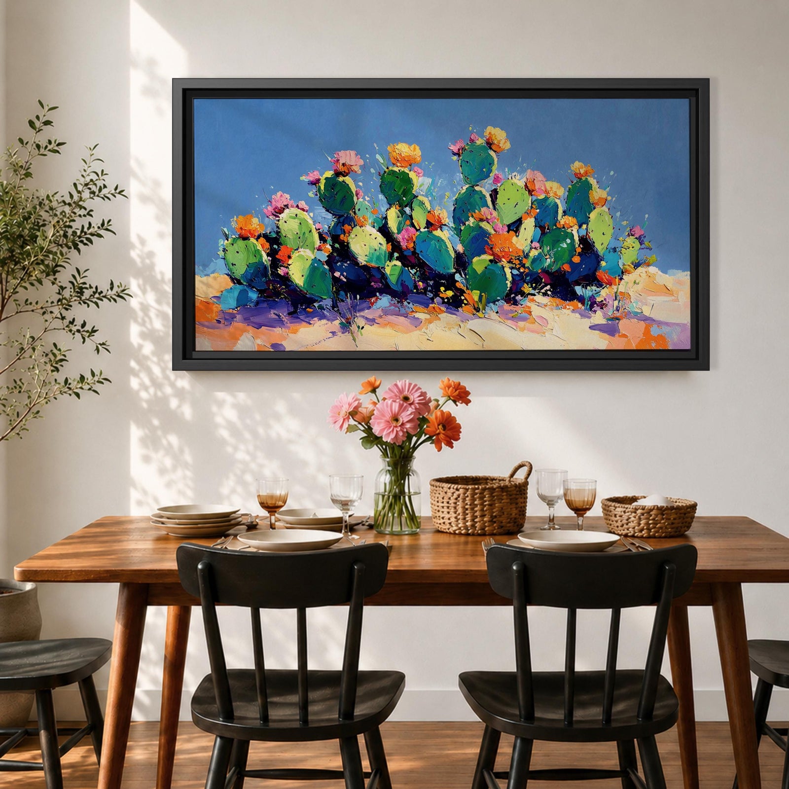 Panoramic painting of desert prickly pear cactus plants with bright pink and yellow blooming flowers growing across a colorful arid landscape. Thick palette knife brushstrokes create textured cactus pads vibrant blossoms and layered desert hills beneath a glowing sky forming a wide southwestern desert scene.