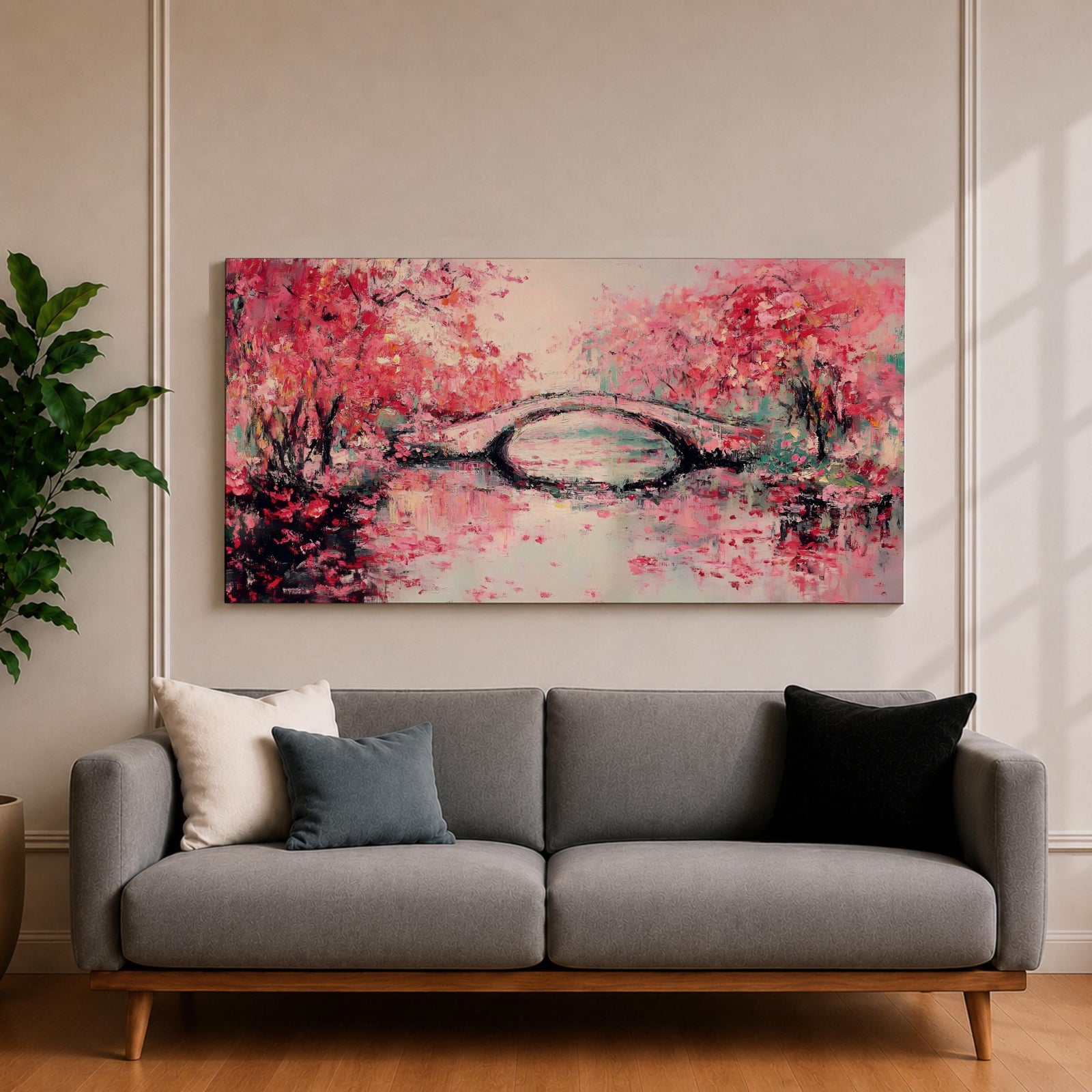 Panoramic painting of blooming cherry blossom trees with soft pink petals surrounding a curved bridge over calm water during spring. Layers of textured brushstrokes form clusters of blossoms drifting across the scene while reflections shimmer on the surface creating a wide Japanese inspired spring landscape composition.