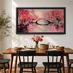 Panoramic painting of blooming cherry blossom trees with soft pink petals surrounding a curved bridge over calm water during spring. Layers of textured brushstrokes form clusters of blossoms drifting across the scene while reflections shimmer on the surface creating a wide Japanese inspired spring landscape composition.