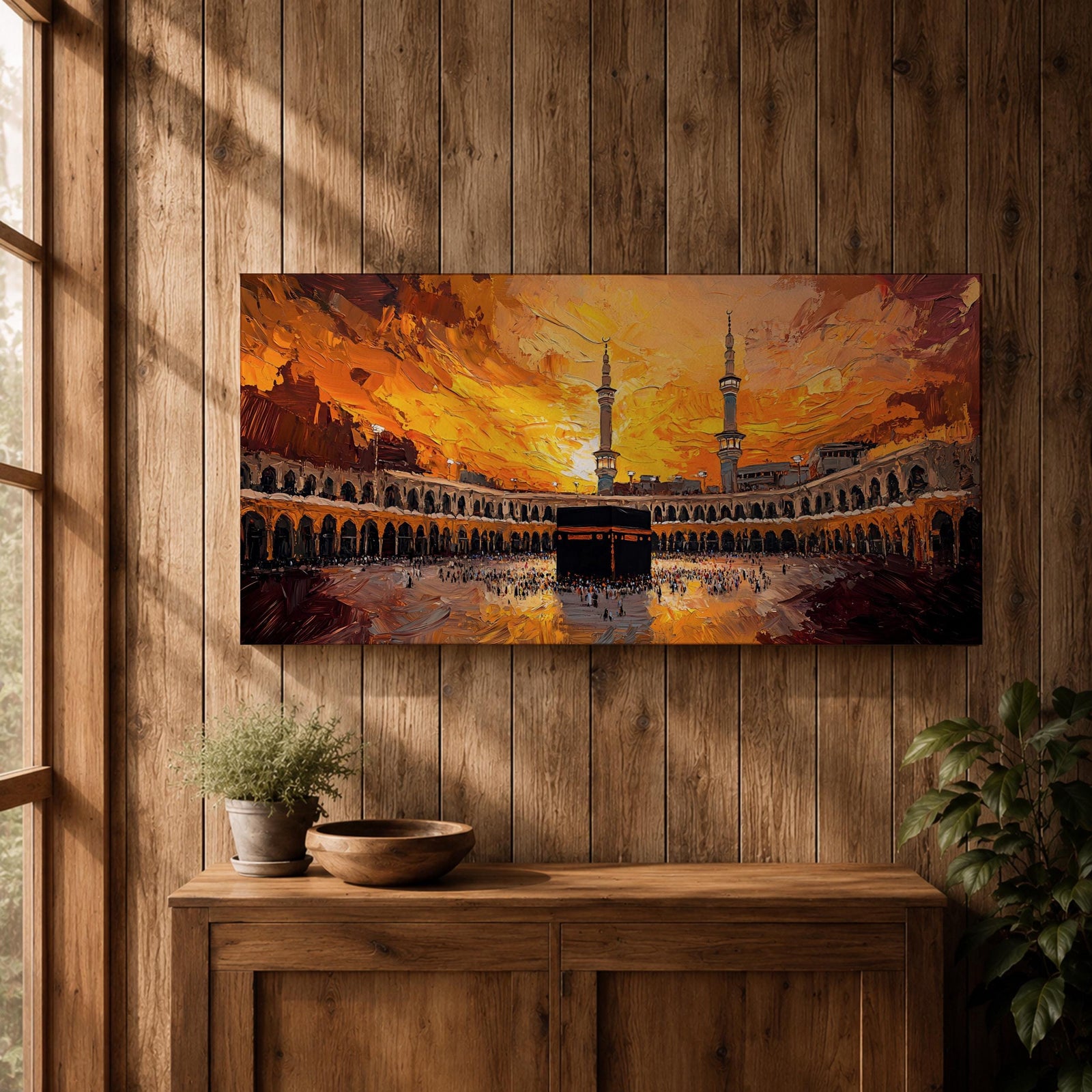 Panoramic impressionist painting of the Kaaba at Masjid al Haram in Mecca with the black cube sanctuary centered within the mosque courtyard. Tall minarets rise above surrounding arcades while dramatic golden sunset skies and expressive brushstrokes fill the wide horizontal composition with warm light and movement.