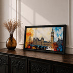 Panoramic abstract painting of the London skyline featuring the Elizabeth Tower known as Big Ben rising above the River Thames with surrounding historic buildings and bridge silhouettes. Thick expressive brushstrokes form textured architecture glowing clock faces and layered reflections across the wide cityscape composition.