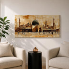 Panoramic painting of Al Masjid an Nabawi in Medina featuring the iconic green dome surrounded by tall minarets and expansive mosque courtyards. The architectural arches and domes are rendered with textured sepia brushwork while small figures walk across the reflective marble courtyard.