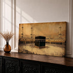 Panoramic sepia toned illustration of the Kaaba centered within the Masjid Al Haram courtyard in Mecca surrounded by worshippers. Tall minarets and arched colonnades frame the sacred cube while the expansive marble plaza and distant cityscape extend across the wide horizontal composition.
