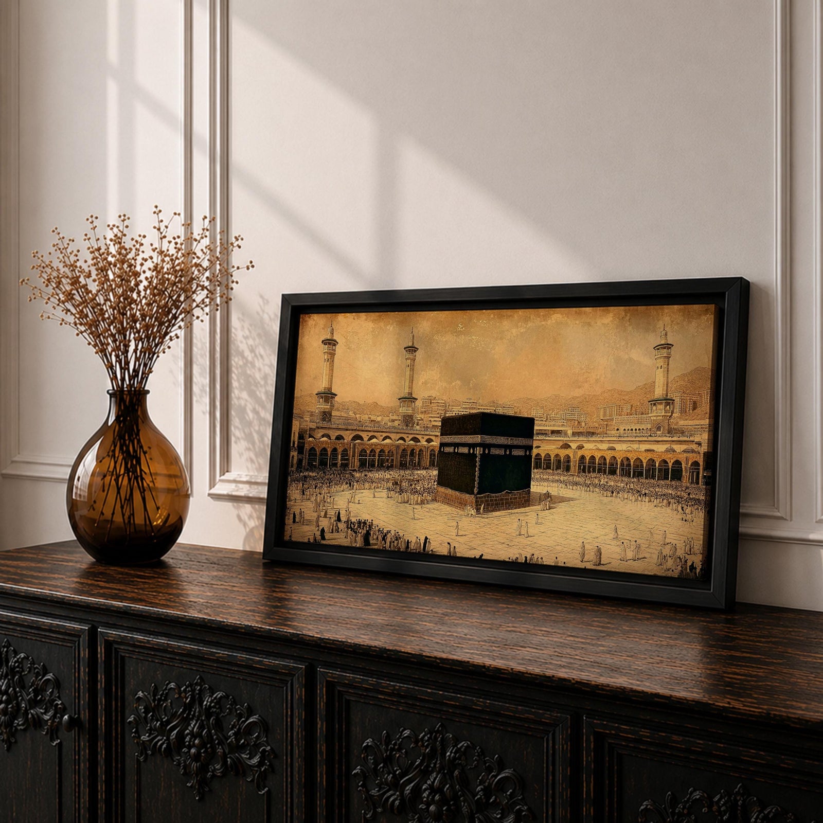 Panoramic sepia toned illustration of the Kaaba centered within the Masjid Al Haram courtyard in Mecca surrounded by worshippers. Tall minarets and arched colonnades frame the sacred cube while the expansive marble plaza and distant cityscape extend across the wide horizontal composition.