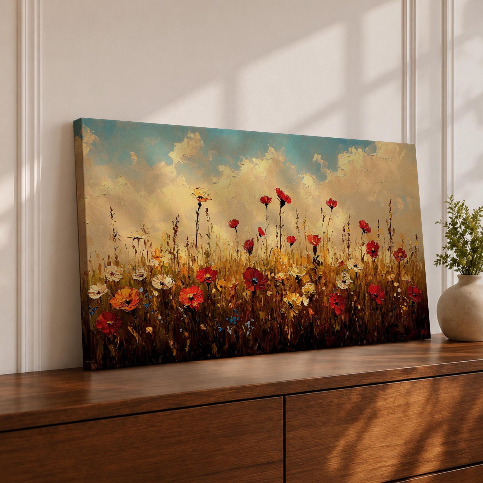 Panoramic painting of a colorful wildflower meadow filled with blooming pink yellow blue and white flowers stretching across rolling green fields beneath a soft sky. Thick palette knife brushstrokes create textured petals tall grasses and distant hills forming a wide natural landscape bursting with seasonal color.