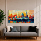 Panoramic abstract painting of Al Masjid an Nabawi in Medina featuring the mosque domes and tall minarets with the iconic green dome at the center. The architecture is rendered with geometric block brushstrokes in vibrant blues, reds, yellows and oranges creating a modern cityscape style composition.