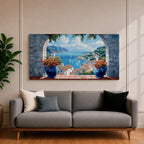 A panoramic painting of a Mediterranean seaside village viewed through a stone arch window, featuring blue ocean waters, sailboats, terracotta rooftops, and vibrant floral pots.