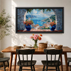 A panoramic painting of a Mediterranean seaside village viewed through a stone arch window, featuring blue ocean waters, sailboats, terracotta rooftops, and vibrant floral pots.