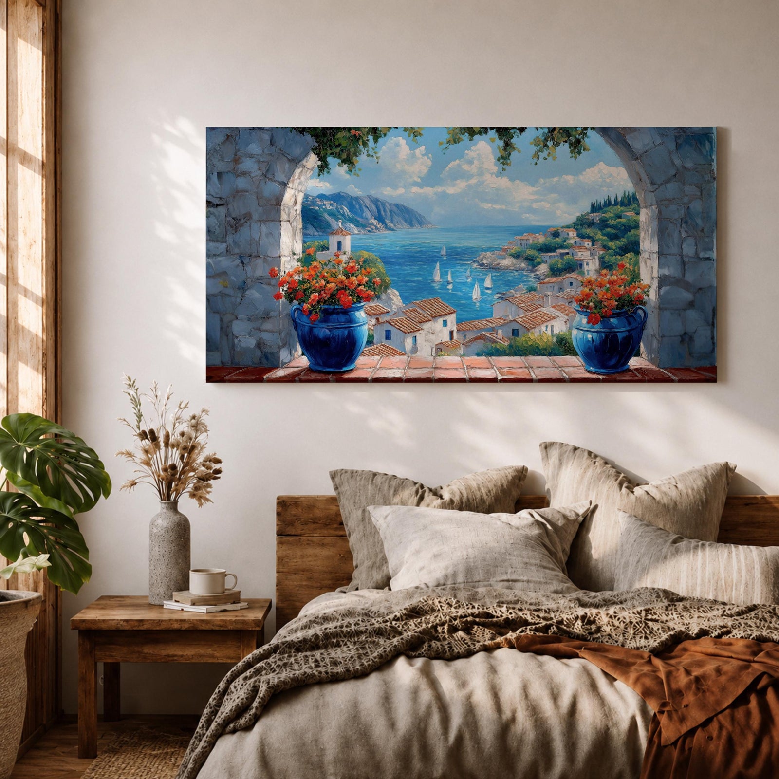 A panoramic painting of a Mediterranean seaside village viewed through a stone arch window, featuring blue ocean waters, sailboats, terracotta rooftops, and vibrant floral pots.