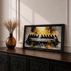 A dramatic panoramic interpretation of the Last Supper showing Jesus seated at the center with his apostles along a long table, rendered in a monochrome palette with striking gold accents and a radiant glowing aura behind Christ, creating a powerful and modern spiritual composition.