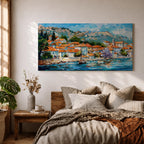 A panoramic painting of a Mediterranean coastal village with terracotta rooftops, colorful homes, and a calm harbor with a sailboat, set against mountains and a bright blue sky, rendered in a textured impressionistic style with vibrant colors.
