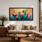 A panoramic textured painting of prickly pear cactus pads in rich teal tones adorned with blooming pink and coral flowers, set against a warm abstract desert background of golden orange and soft pastels, rendered with thick brushstrokes that create depth, contrast, and a vibrant southwestern composition.