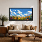 A panoramic painting of a colorful wildflower meadow under a bright blue sky with soft clouds, creating a vibrant and uplifting landscape scene.