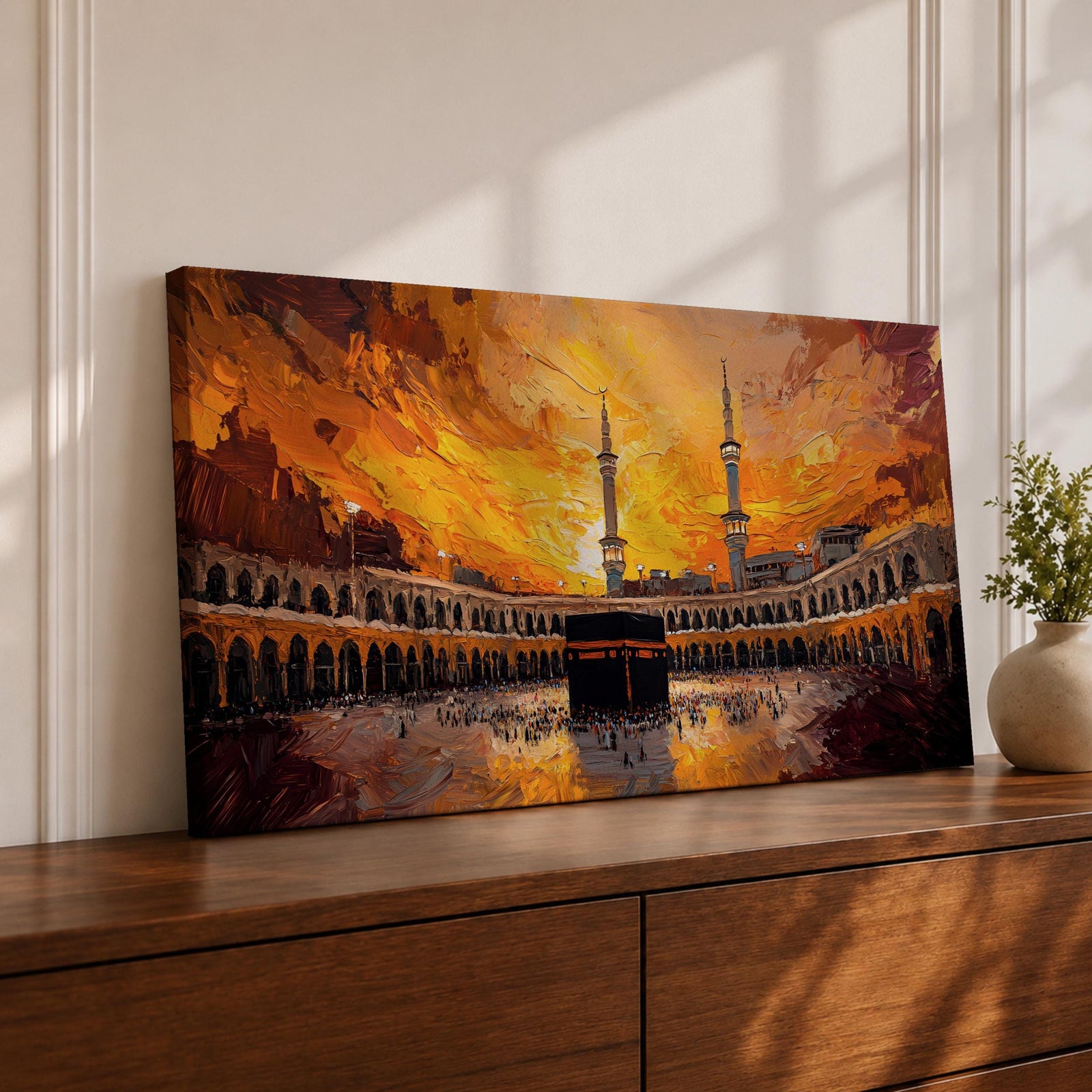 A panoramic painting of the Kaaba in Mecca surrounded by the Grand Mosque, set against a dramatic golden sunset sky with expressive brushstrokes and warm tones.
