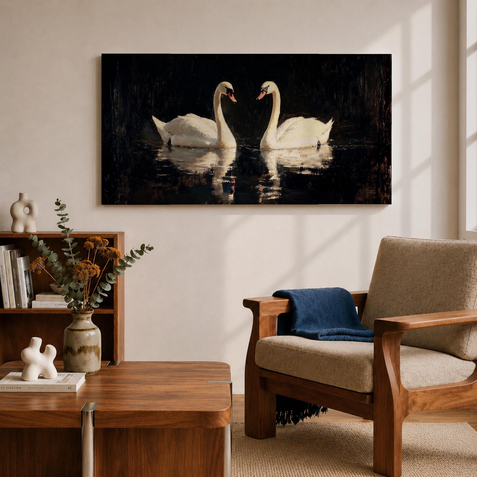 Panoramic painting of two white swans facing each other on dark reflective water with graceful curved necks forming a symmetrical composition. The birds glow against a deep black background with shimmering reflections and textured brushstrokes highlighting feathers and light across the calm water surface.