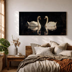 Panoramic painting of two white swans facing each other on dark reflective water with graceful curved necks forming a symmetrical composition. The birds glow against a deep black background with shimmering reflections and textured brushstrokes highlighting feathers and light across the calm water surface.