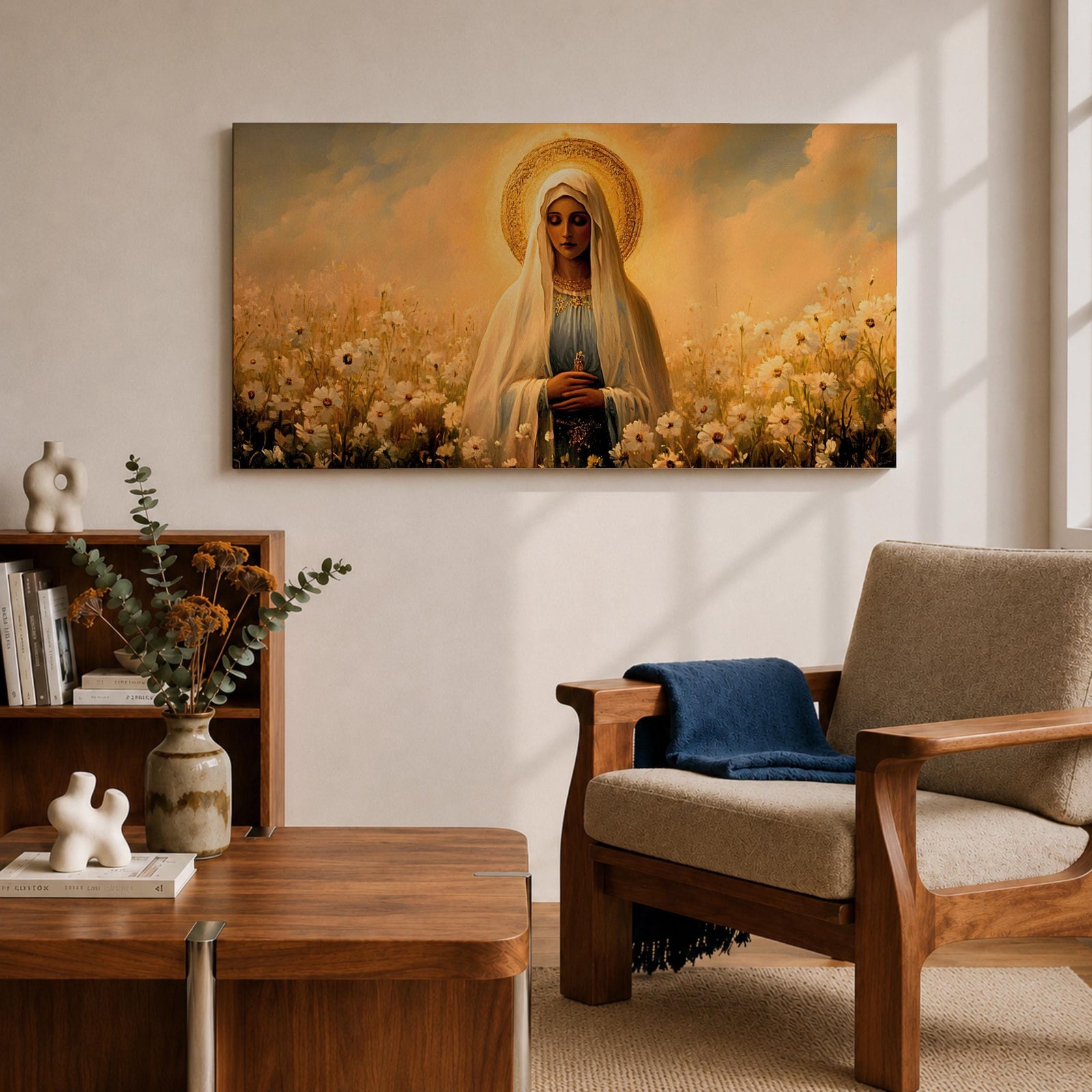 Panoramic painting of the Virgin Mary standing in a field of white flowers with a golden halo surrounding her head. She wears a flowing veil and robe while holding her hands gently together. Warm golden sky tones and soft floral details create a serene devotional composition.
