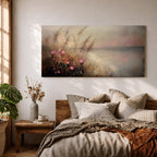 Panoramic landscape painting of soft pink wildflowers and tall grasses growing along a calm lakeshore. The scene features delicate meadow blooms in the foreground with textured brushstrokes and warm earthy tones, fading into a misty reflective lake and distant horizon under a gentle sky.