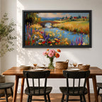Panoramic landscape painting of a winding river flowing through a countryside meadow filled with colorful wildflowers. A small stone bridge arches over the water while fields, cottages, and rolling hills stretch into the distance under a bright sky, rendered with vibrant textured brushstrokes.
