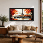 Panoramic painting of the Eiffel Tower rising above the Seine River with an arched stone bridge and classic Parisian buildings along the waterfront. Vibrant red and orange autumn trees frame the scene while textured brushstrokes reflect warm foliage and architecture across the calm river surface.