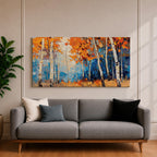 Panoramic painting of tall white birch trees with textured bark standing among vivid orange autumn foliage. Thick palette knife brushstrokes create layered leaves and forest floor tones, with warm golden light filtering through the canopy against cool blue woodland shadows.