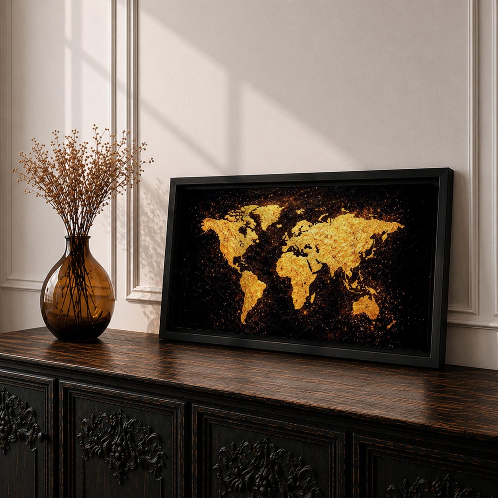 Panoramic artwork of a world map rendered in textured metallic gold against a deep black background. The continents appear with rough painterly edges and splattered gold accents, creating a bold global composition with strong contrast and modern map styling.