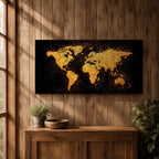 Panoramic artwork of a world map rendered in textured metallic gold against a deep black background. The continents appear with rough painterly edges and splattered gold accents, creating a bold global composition with strong contrast and modern map styling.