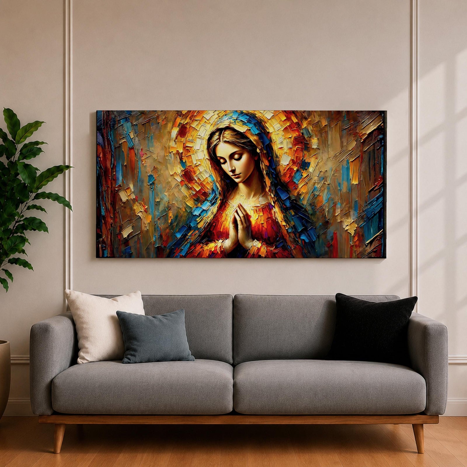 Panoramic textured painting of the Virgin Mary with hands clasped in prayer and a radiant halo behind her head. The composition features expressive palette knife strokes in gold, blue, red, and warm earth tones forming a luminous devotional portrait.