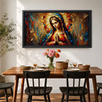 Panoramic textured painting of the Virgin Mary with hands clasped in prayer and a radiant halo behind her head. The composition features expressive palette knife strokes in gold, blue, red, and warm earth tones forming a luminous devotional portrait.