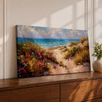 Panoramic coastal landscape painting of sandy beach dunes leading toward turquoise ocean waves under a bright sky. Tall grasses and colorful wildflowers line a winding path through the dunes, painted with loose textured brushstrokes capturing sunlight, sea breeze, and shoreline scenery.