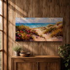 Panoramic coastal landscape painting of sandy beach dunes leading toward turquoise ocean waves under a bright sky. Tall grasses and colorful wildflowers line a winding path through the dunes, painted with loose textured brushstrokes capturing sunlight, sea breeze, and shoreline scenery.