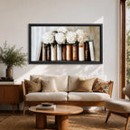 Panoramic still life painting of white hydrangea flowers arranged inside stacked vintage books with neutral beige and cream tones in a soft textured background.