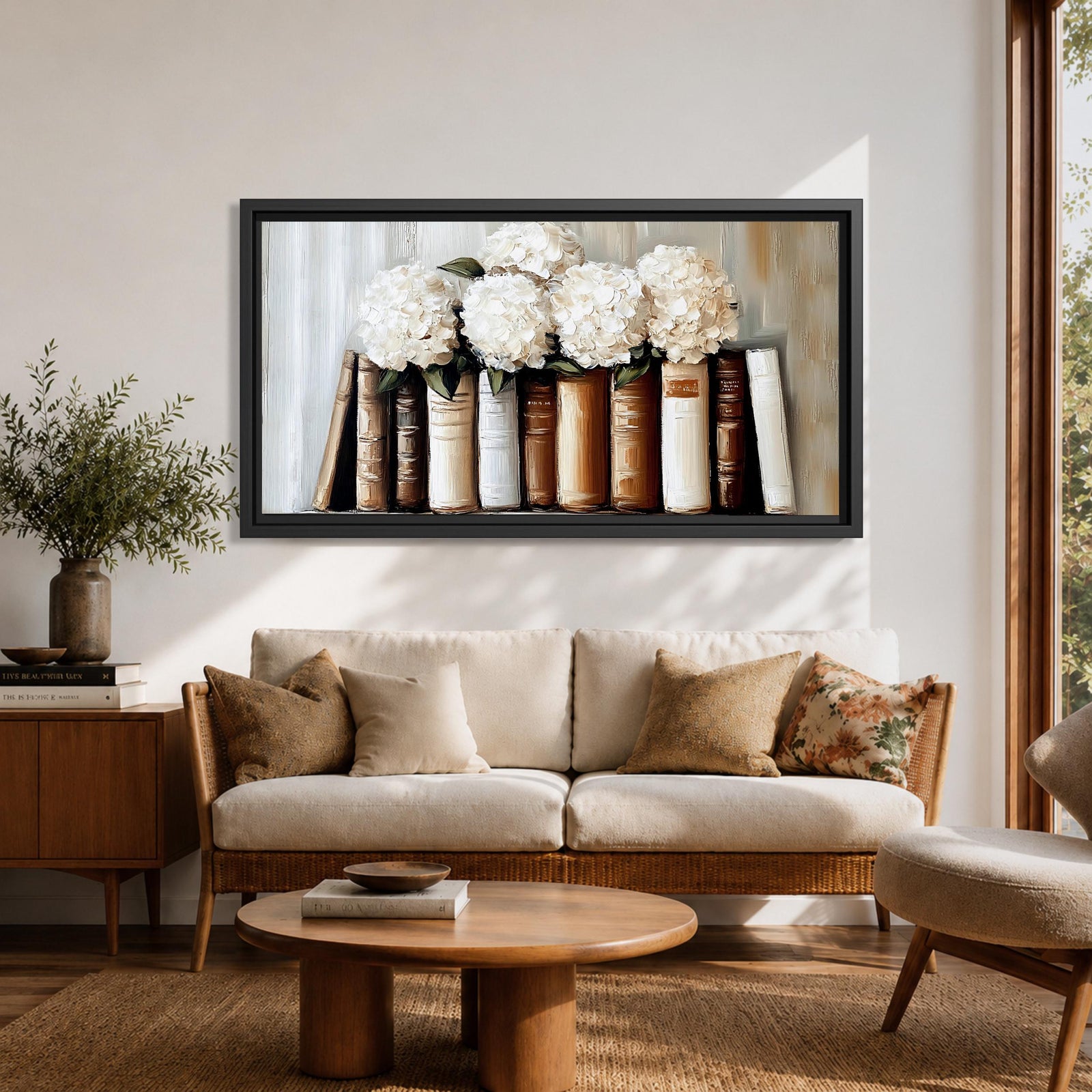 Panoramic still life painting of white hydrangea flowers arranged inside stacked vintage books with neutral beige and cream tones in a soft textured background.