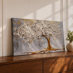 Panoramic artwork of a white blossoming tree with a flowing golden trunk and roots spreading across a textured gray background symbolizing the tree of life.