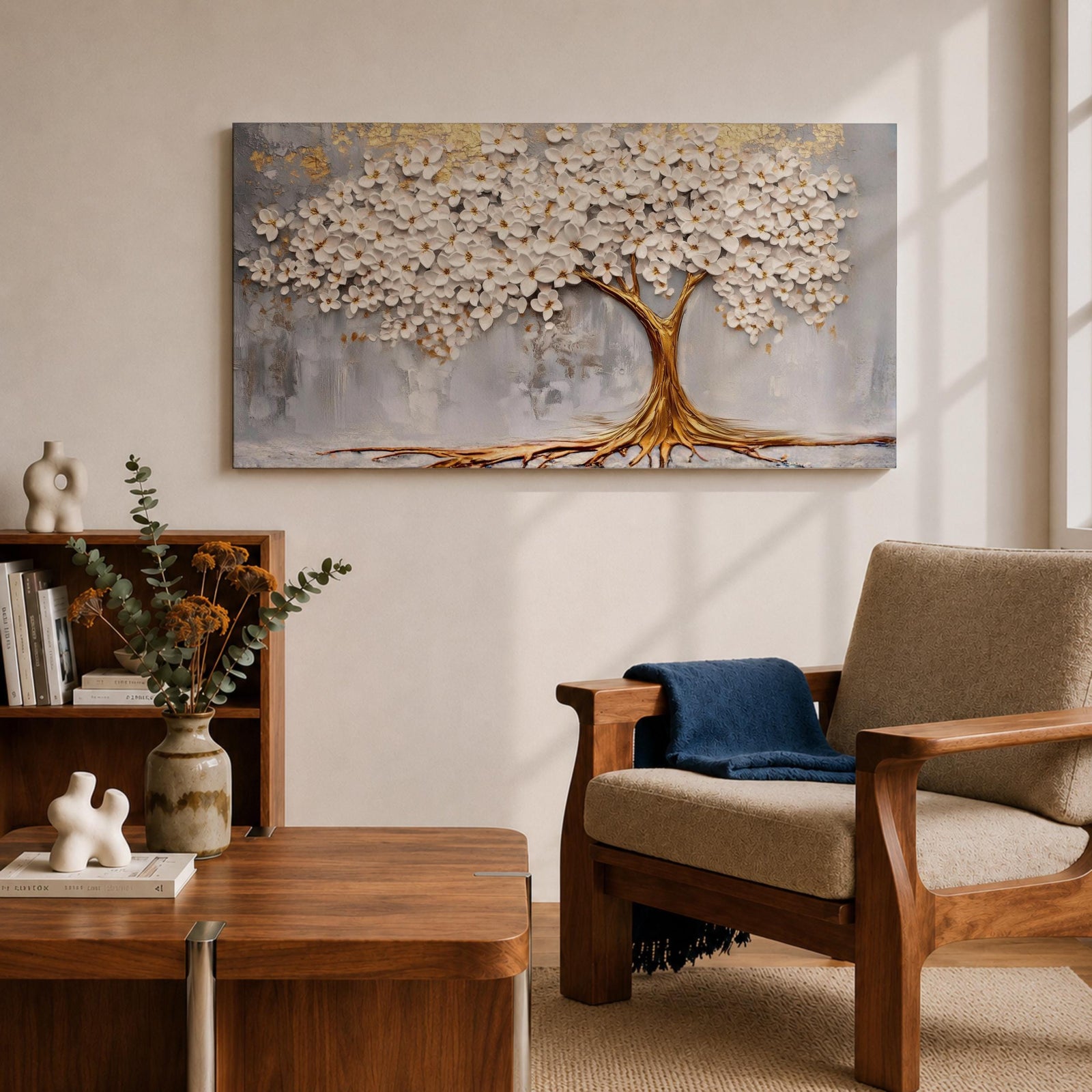 Panoramic artwork of a white blossoming tree with a flowing golden trunk and roots spreading across a textured gray background symbolizing the tree of life.
