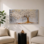 Panoramic artwork of a white blossoming tree with a flowing golden trunk and roots spreading across a textured gray background symbolizing the tree of life.