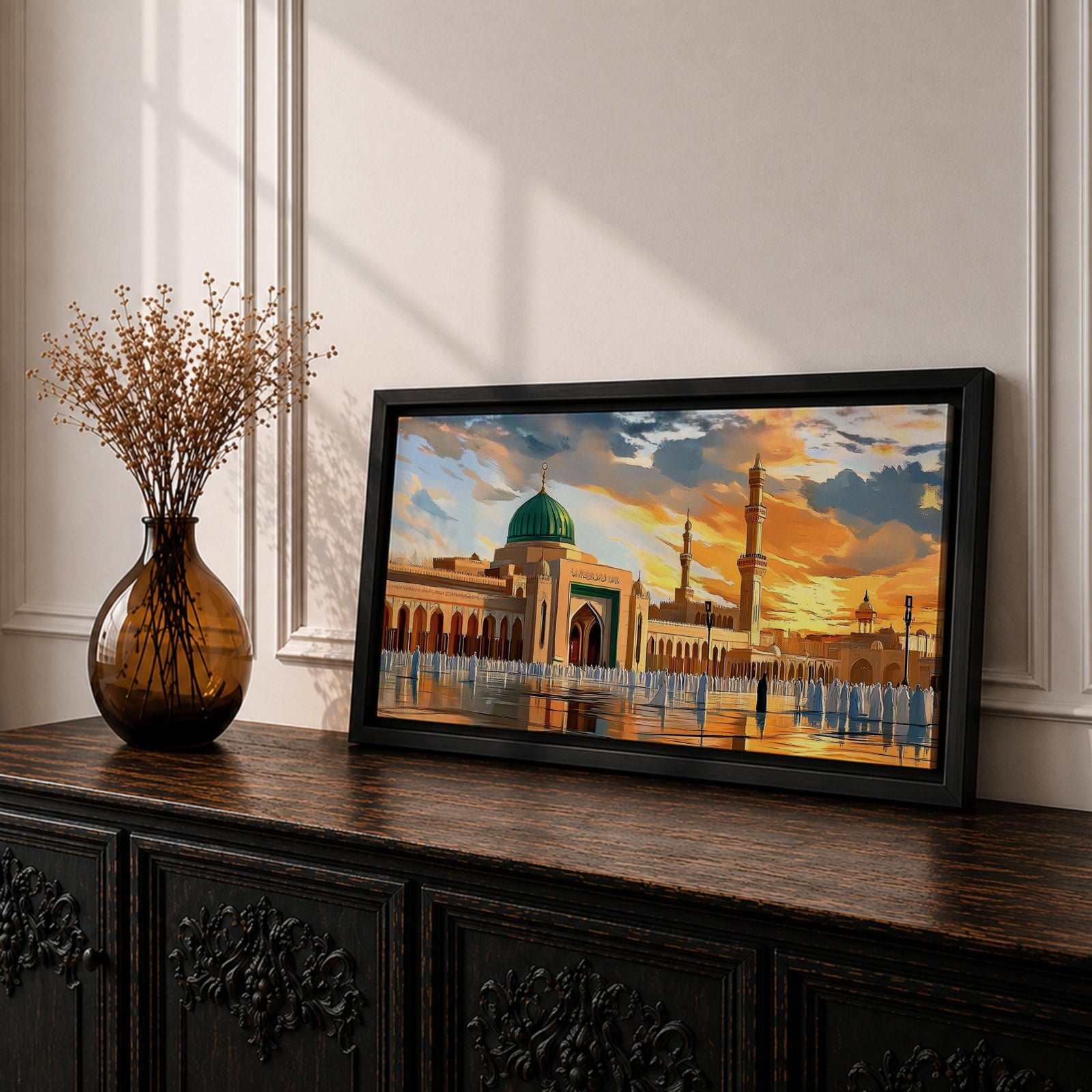 Panoramic painting of Al Masjid an Nabawi in Medina featuring the iconic green dome rising above the mosque courtyard with surrounding arcades and tall minarets. Pilgrims gather across the reflective marble plaza while dramatic sunset clouds illuminate the historic Islamic architecture.