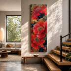 A tall, narrow vertical painting of bold red poppy flowers with layered petals and detailed centers, set against a deep navy and gold textured abstract background, featuring rich contrast, fluid brushwork, and metallic accents that highlight the organic forms in a contemporary floral composition.