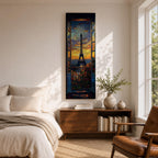 Long vertical painting of the Eiffel Tower seen through an open window with balcony railings and flowers in the foreground. A dramatic sunset sky glows with orange and blue tones above the Paris skyline while expressive brushstrokes create a romantic cityscape composition.