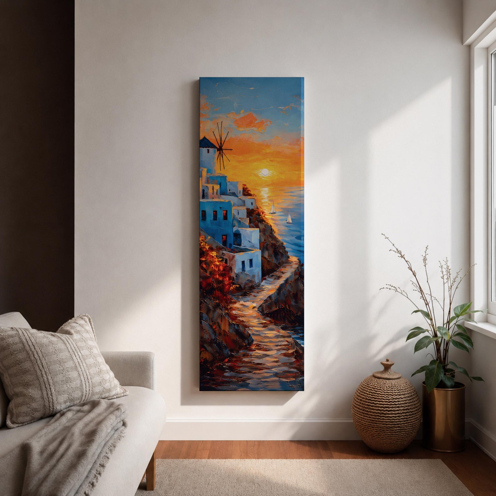 A tall vertical painting depicts a Santorini coastal scene with whitewashed buildings perched along a cliffside, a winding stone path leading toward the sea, and a glowing sunset casting warm orange and gold light across the sky and water, with a windmill silhouette and small sailboats adding depth to the vibrant Mediterranean composition.