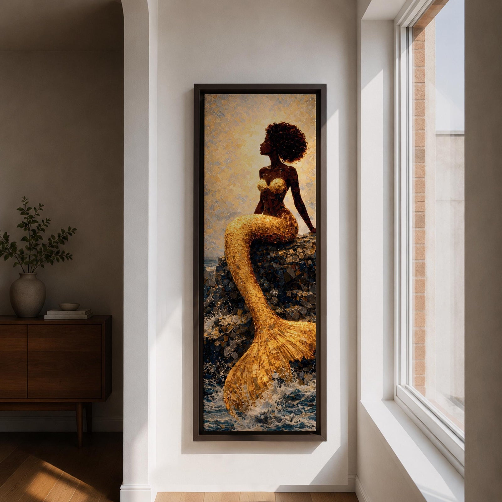 A tall narrow vertical depiction of a Black mermaid with a natural afro hairstyle seated on rocky shoreline, her shimmering gold tail cascading downward into the water, rendered with textured tile like detail and warm light reflecting across her form, creating a bold composition with contrast, depth, and coastal atmosphere.