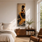 A tall narrow vertical depiction of a Black mermaid with a natural afro hairstyle seated on rocky shoreline, her shimmering gold tail cascading downward into the water, rendered with textured tile like detail and warm light reflecting across her form, creating a bold composition with contrast, depth, and coastal atmosphere.