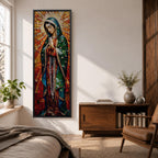 Long vertical stained glass style depiction of Our Lady of Guadalupe with hands clasped in prayer. She wears a green mantle decorated with stars and a red robe while radiant golden rays form a halo behind her, composed of colorful mosaic glass pieces forming a luminous devotional image.