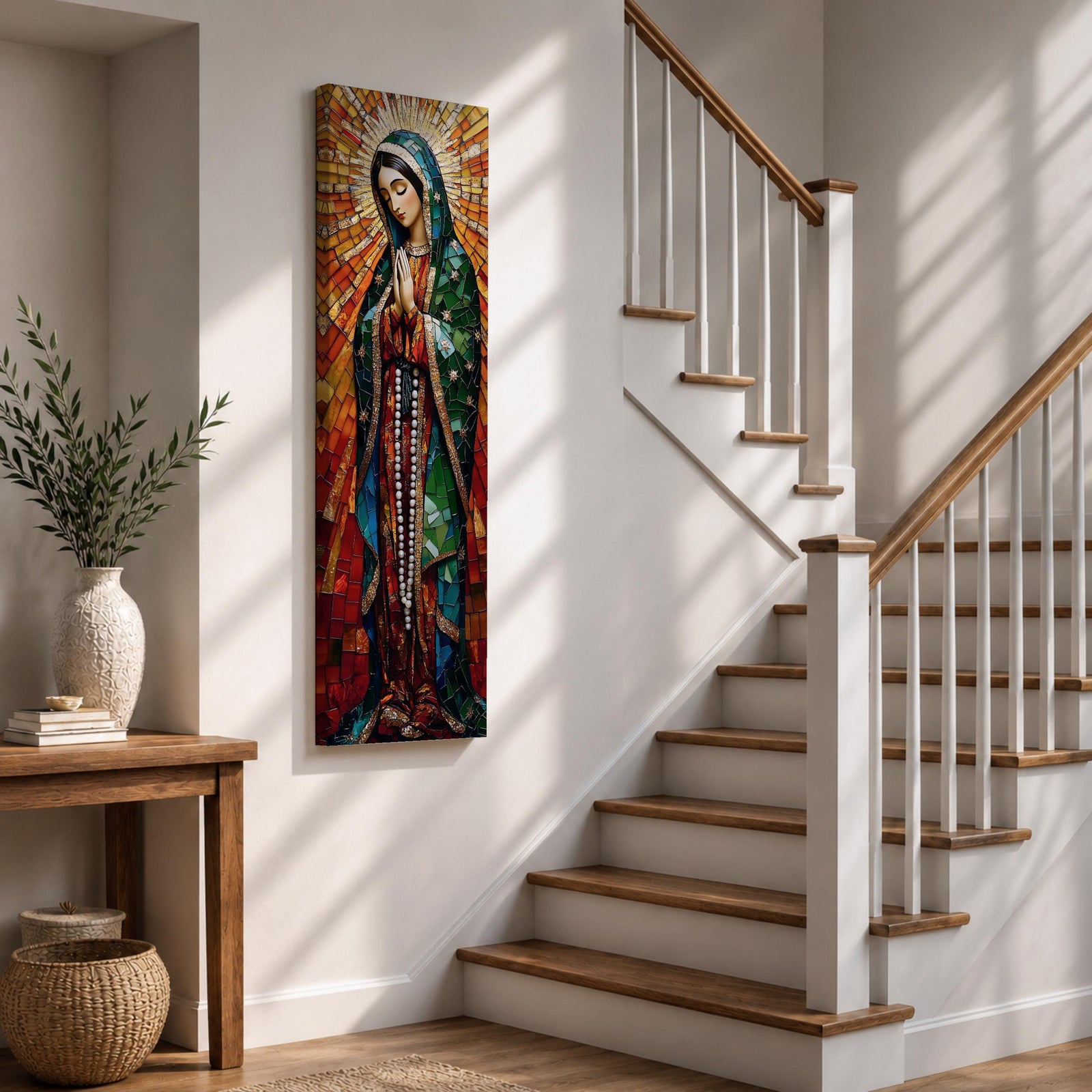 Long vertical stained glass style depiction of Our Lady of Guadalupe with hands clasped in prayer. She wears a green mantle decorated with stars and a red robe while radiant golden rays form a halo behind her, composed of colorful mosaic glass pieces forming a luminous devotional image.