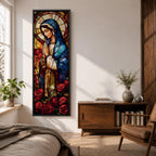 Long vertical stained glass style depiction of the Virgin Mary with hands clasped in prayer. She wears a blue mantle and cream robe while a circular halo glows behind her head and red roses bloom at her feet, all formed with colorful glass segments in a luminous devotional composition.