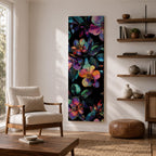 Tall vertical botanical artwork featuring glowing neon flowers in vibrant rainbow colors against a deep black background. Large luminous blossoms in pink, orange, purple, and blue are surrounded by detailed leaves, creating a modern floral composition with bold contrast and iridescent color transitions.