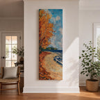 Tall vertical landscape painting of an autumn shoreline with golden orange trees lining a sandy beach beside deep blue water. Thick palette knife brushstrokes create textured waves, falling leaves, and swirling sky patterns while the curved shoreline leads toward a distant forest horizon.