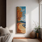 Tall vertical landscape painting of an autumn shoreline with golden orange trees lining a sandy beach beside deep blue water. Thick palette knife brushstrokes create textured waves, falling leaves, and swirling sky patterns while the curved shoreline leads toward a distant forest horizon.