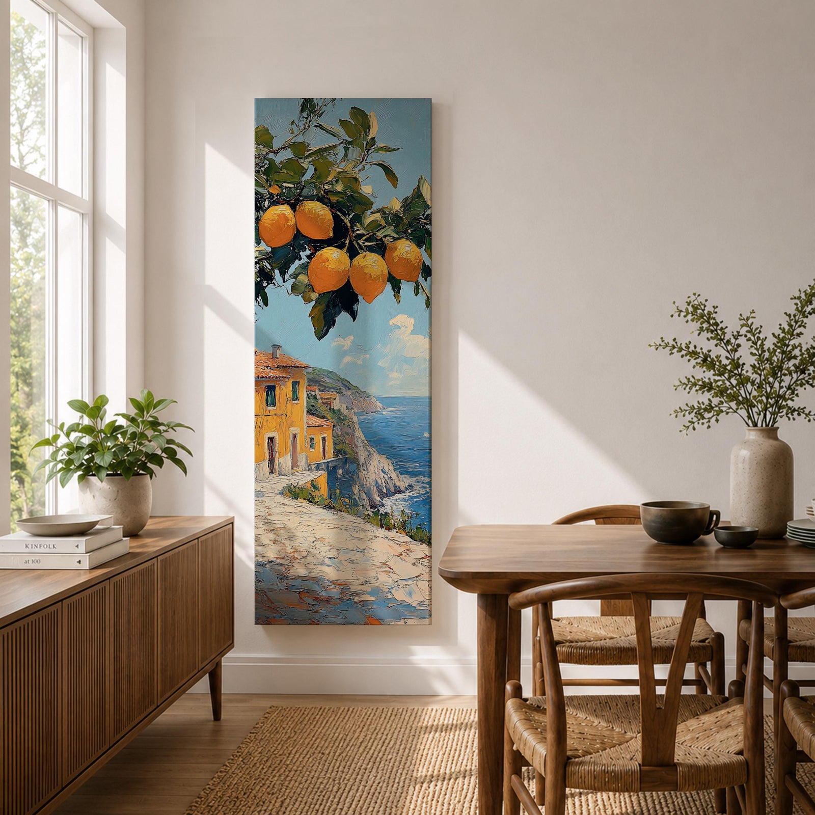 Tall vertical Mediterranean coastal painting showing bright yellow lemons hanging from a leafy branch above an Amalfi seaside village. Colorful Italian buildings sit along a cliffside path overlooking deep blue ocean waters beneath a sunny sky.