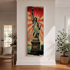Long vertical retro poster style artwork featuring the Statue of Liberty standing on her pedestal holding the torch high with a tablet in her arm. Bold red sunburst rays radiate behind the monument while distressed textures and muted green tones create a vintage propaganda inspired illustration of the iconic New York landmark.